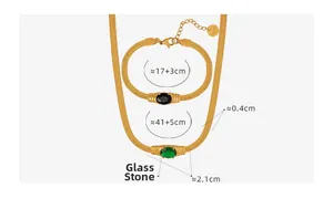 Detail of gold snake chain jewelry set with green and black oval glass stones