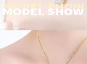 Close-up of a minimalist gold pendant necklace worn by a model to show elegant neck detail