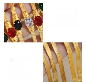 Macro detail of vintage 18K gold plated surgical steel necklace with colorful zircon