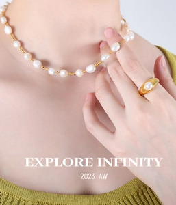 Detailed view of 18K gold plated jewelry set with baroque freshwater pearls on a model