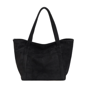 Minimalist black matte suede tote bag with front pocket and dual shoulder straps