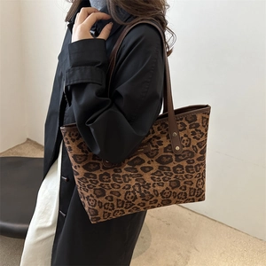 Fashionable leopard print tote bag for women shown as a stylish shoulder bag in use