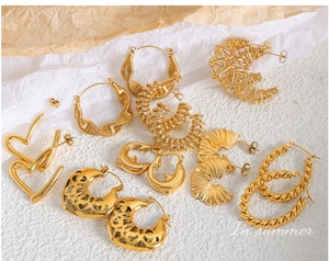 Detailed close-up of mixed vintage 18K gold-plated twisted and hollow hoop earrings
