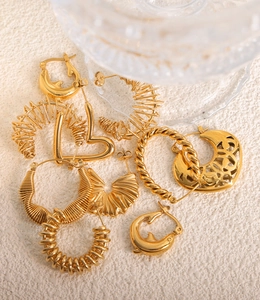 Detailed close-up of textured 18K gold-plated titanium earrings with twisted mesh patterns