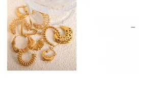Close-up of assorted 18K gold-plated titanium earrings with twist and hollow textures