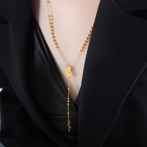 French vintage gold Y-shaped cross necklace with beads and a heart pendant for women