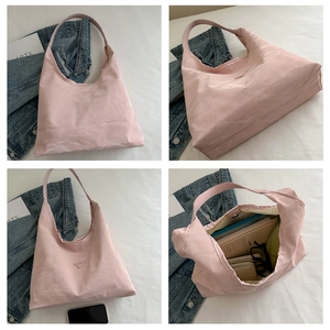Detail view of large capacity tote bag with marble texture showing spacious interior