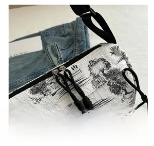 Detail of smooth zipper and tie-dye ink pattern on water-resistant nylon shoulder bag