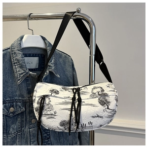 Detail of white nylon crossbody bag with ink landscape print and pleated texture