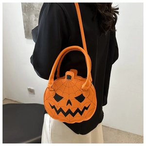 Close-up of Halloween pumpkin bag with Jack-o'-lantern face and spider web texture