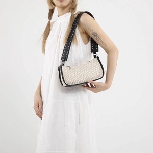 Summer straw and PU patchwork underarm bag with silver studded wide shoulder strap