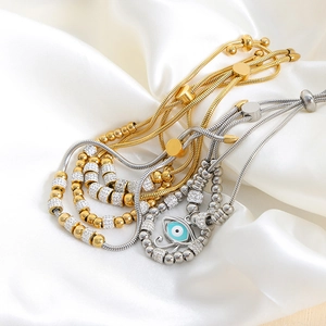 Pulsera ajustable de ojo turco con micro cristales pavé en acabado oro y plata