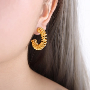 Gold-plated C-shaped hoop earrings with unique spring coil texture for women