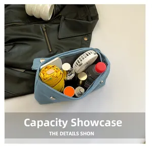 Internal view showing large capacity for umbrella, fan, water bottle and cosmetics