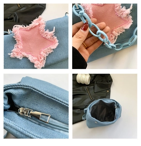 Detail view of denim star patch, light blue plastic chain and interior of the crossbody bag