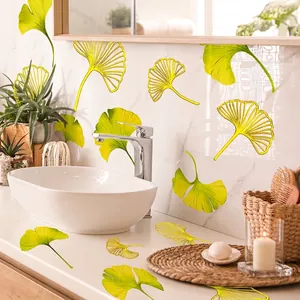 Ginkgo leaf wall decals with green gradient and gold lines on marble bathroom wall