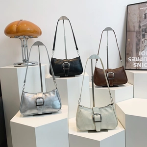 Minimalist shoulder bags in silver, black, brown and beige with geometric stitching