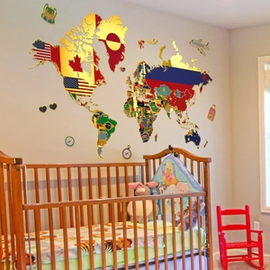 Detail of world map wall sticker with flags and gold outlines in a nursery room