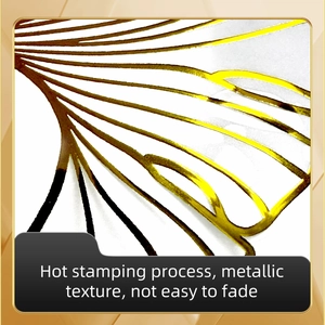 Macro detail of golden ginkgo leaf wall sticker with hot stamping metallic texture