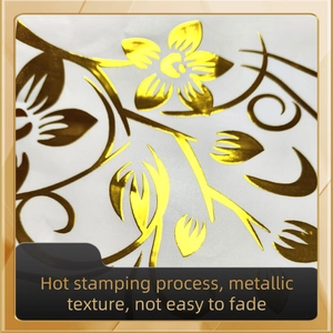 Detailed close-up of metallic hot stamping gold floral pattern on self-adhesive wall sticker