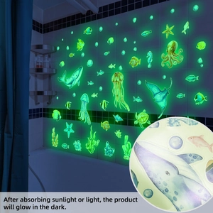 Glow-in-the-dark ocean world wall stickers with octopus and jellyfish in bathroom setting