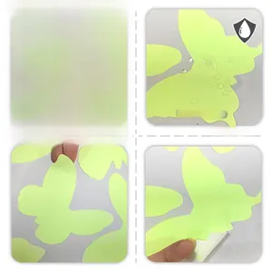Detailed macro view of fluorescent green butterfly wall stickers with waterproof PVC texture