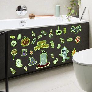 Luminous Halloween wall stickers with glowing pumpkin and ghost on a dark bathtub