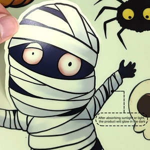 Close-up of luminous mummy sticker showing glow-in-the-dark texture for Halloween decor