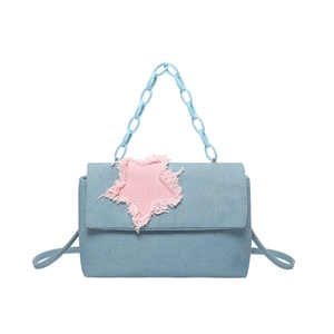 Star patchwork denim tote bag with pink frayed star detail and chunky blue chain strap