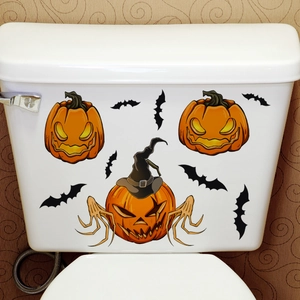 Luminous Halloween pumpkin and bat wall stickers on white ceramic surface