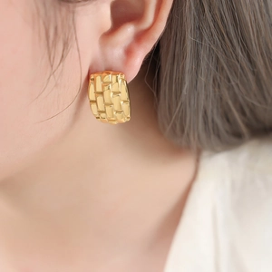 Luxurious gold-plated titanium steel earrings featuring a textured woven lattice design