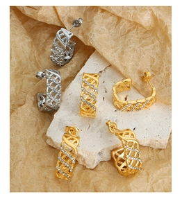Detailed close-up of C-shaped hollow lattice earrings with inlaid sparkling crystals