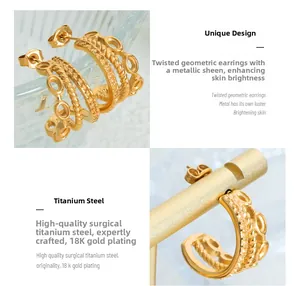 Macro detail of triple-layered 18K gold plated titanium steel C-hoop earrings