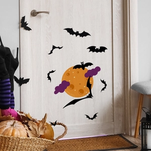 Detail showing spooky Halloween bat decals with orange moon and purple clouds on a door