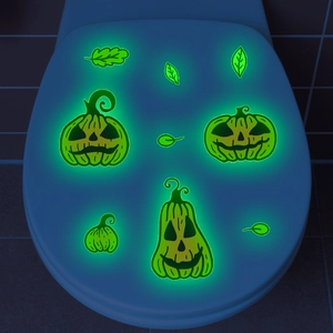 Luminous green Halloween pumpkin wall stickers glowing on a dark blue background