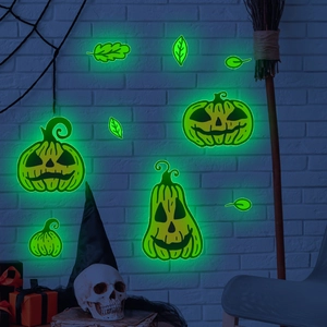 Luminous Halloween pumpkin wall stickers glowing in dark on white brick background