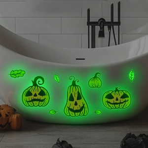 Luminous Halloween pumpkin stickers glowing in neon green on a modern bathtub wall