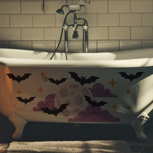 Detailed Halloween wall stickers with bats, gray moon and stars on a white bathtub