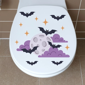 Detailed view of Halloween toilet lid decals with black bats, full moon and stars