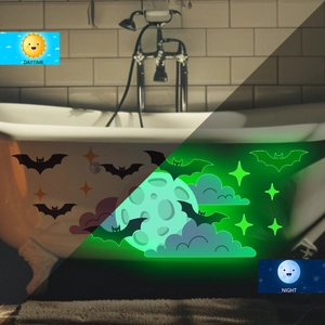 Glow-in-the-dark moon and bat wall stickers showing day and night effect in bathroom