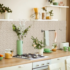 Macro view of beige embossed tile stickers with geometric floral relief for kitchen backsplash