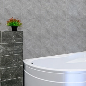 Close-up of waterproof light gray marble wall tiles installed in a modern bathroom decor