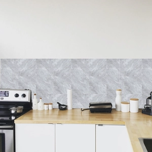 Detail of gray marble pattern adhesive backsplash tiles applied in a modern kitchen