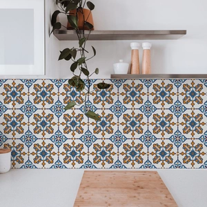 Detail of Mediterranean blue and yellow geometric flower tile stickers on kitchen backsplash