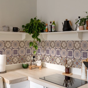 Detailed view of Bohemian patterned tile stickers with blue and ochre geometric designs
