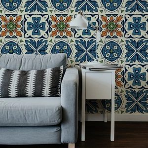 Detail of vintage French floral tile wall stickers in a living room sofa background setup