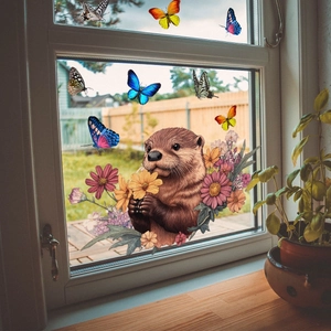 Détail de stickers de fenêtre loutre et papillons sur une surface vitrée transparente