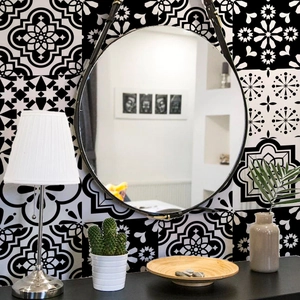 Detail of vintage black and white mandala geometric pattern tile stickers in home interior