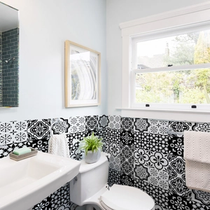 Detail of waterproof black and white mandala style marble tiles for bathroom wall decor