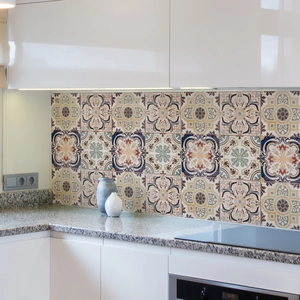 Detail of vintage mandala tile stickers on a kitchen backsplash with waterproof finish